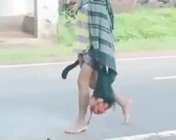 Man walks down the street with his wife’s head in his hand