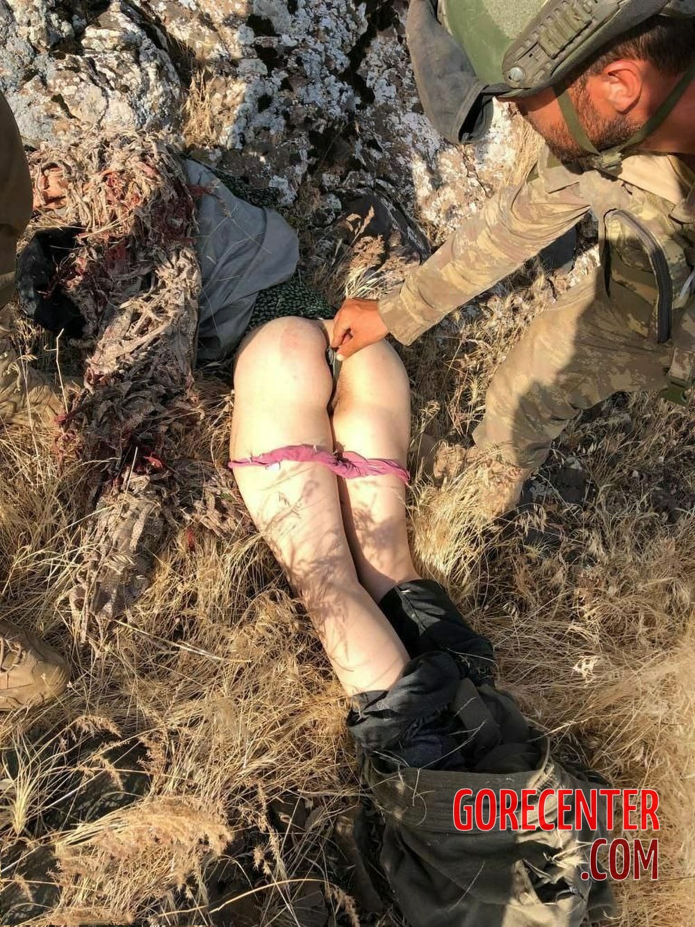 Corpse of female soldier was sexually violated by enemy soldiers.
