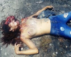 Half-naked corpse of girl with her head split open