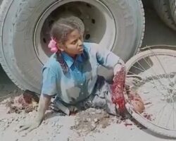 Young Indian girl waiting to die under a truck