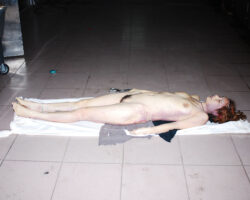 Dead naked woman in morgue