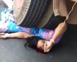 Indian woman pinned under truck wheel