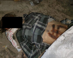Dead Ukrainian girl with burnt swastika