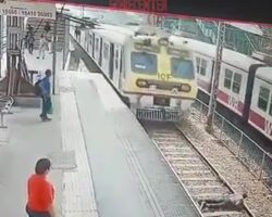 Indian man lay down under train