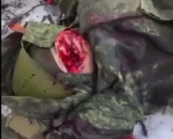 Dead Russian soldier kicked in his head
