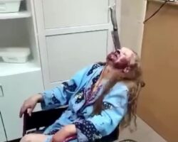 Elderly woman with knife stuck in her face