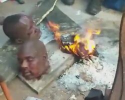 Bunch of Nigerians having fun with severed heads
