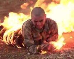 Burning two Turkish soldiers alive