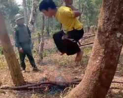 Vietnamese thief hanging over fire