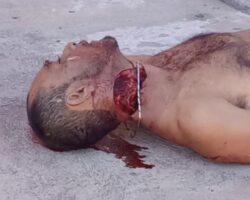 Man lies dead with open wound on his neck