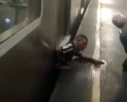 Dude crushed between platform and train