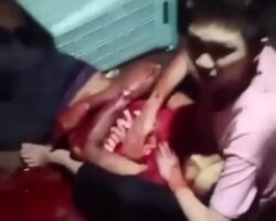 Son holds his dead mother’s body after his father stabbed her