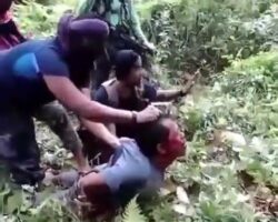 Sloppy beheading of captive in the middle of rainforest