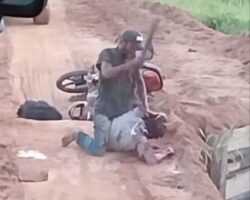 Crazy dude beheading his victim on the roadside