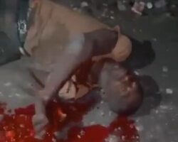 Execution of African dude by shot in neck