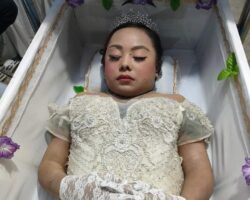 Photos from funeral of Asian woman