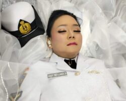 Funeral of Asian woman in uniform
