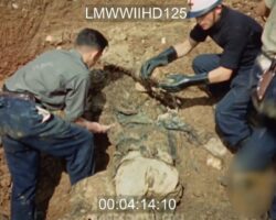 Colorized footage of mass grave exhumation during WWII