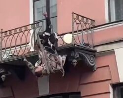 Fighting married couple falls from balcony