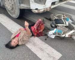 Middle-aged woman has her lower part crushed by concrete truck