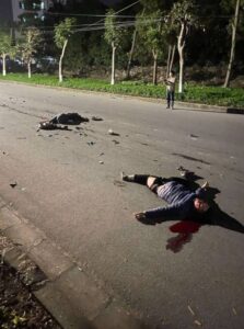Two people on motorcycle collide head-on with small truck