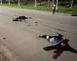 Two people on motorcycle collide head-on with small truck