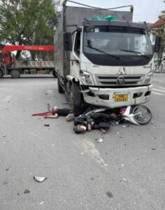 Two young men on motorcycle crash at full speed into truck