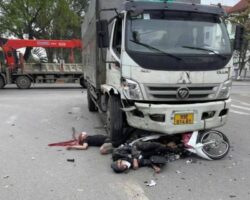 Two young men on motorcycle crash at full speed into truck