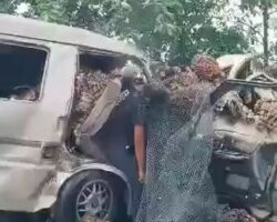 Aftermath of head-on collision between van and pickup truck