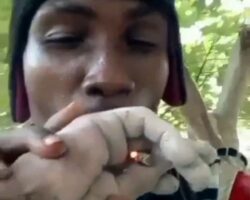 Dude uses his rival’s severed hand to smoke cigarette