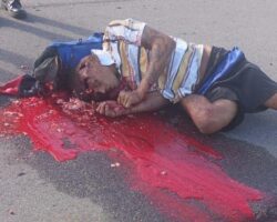 Executed by shotgun blast on street in broad daylight
