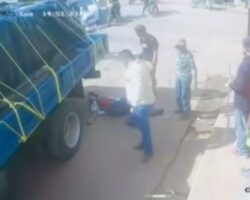 Man falls from back of truck directly under its wheels