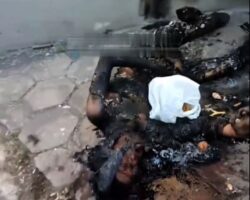 Security worker found burned in side alley