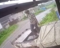 Truck driver electrocuted while securing tarp