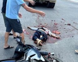 Motorcyclist crashes into truck at intersection