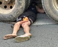 Woman commits suicide by lying under truck wheels