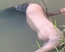 Topless body of young woman found in river