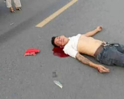 Two men on moped collide head-on with car