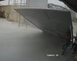 Woman fatally crushed by warehouse doors
