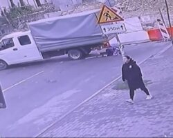 Woman ran over by reversing truck
