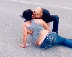 Aggressive girlfriend falls under car