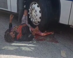 Homeless man crushed by bus but still alive