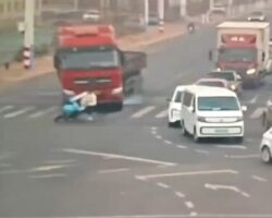 Moped rider crosses path of moving truck
