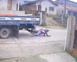 Reversing truck driver ran over two men