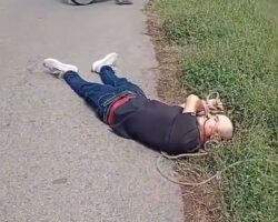 Two dead and tied men found dumped by roadside