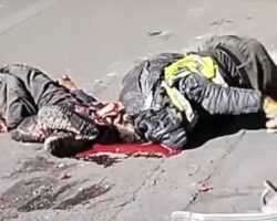 Two workers on motorcycle crushed by truck