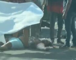 Woman on motorcycle collides head-on with van