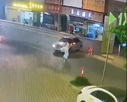 Woman struck, run over, and dragged by car