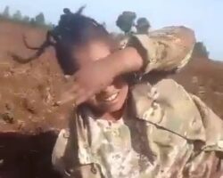 Female soldier shot by enemy forces while attempting to surrender