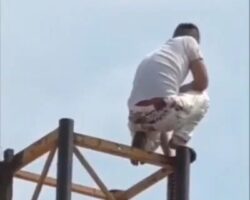 Guy commits suicide by jumping from top of construction elevator